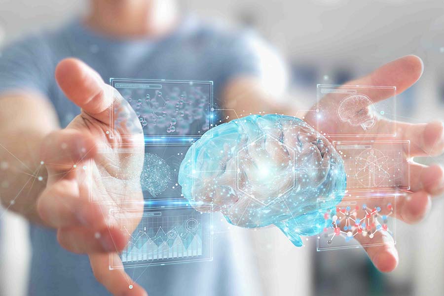 Digital representation of brain with hand holding it