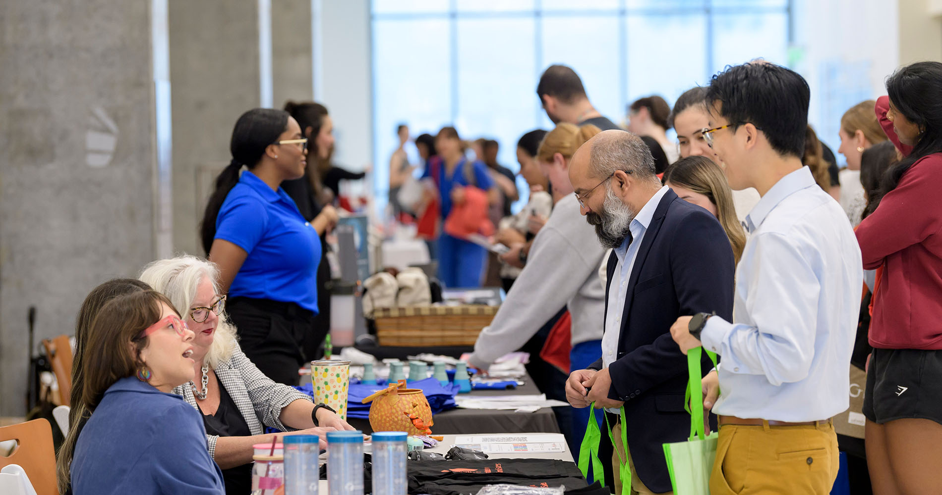 GSBS Students greeting vendors at a booth
