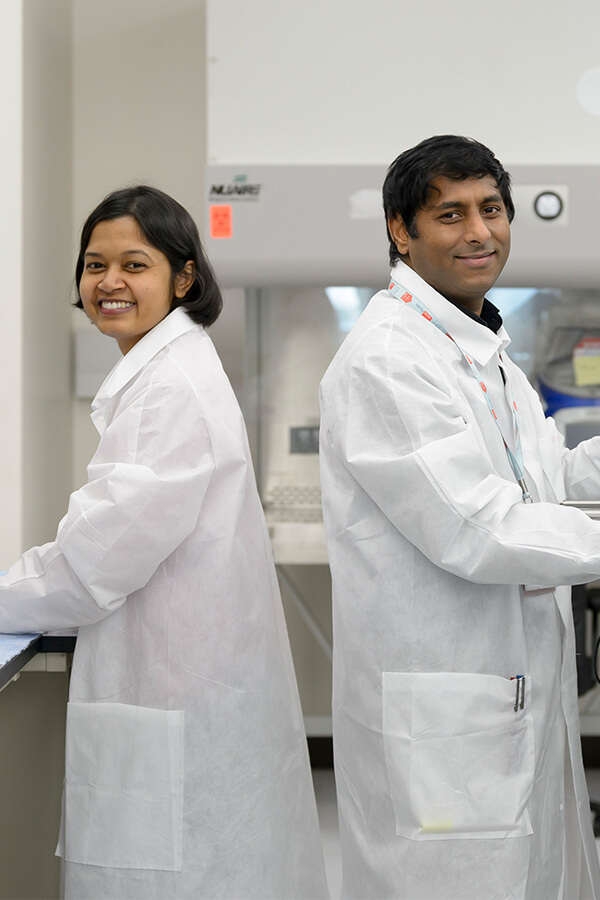Two lab members in a lab