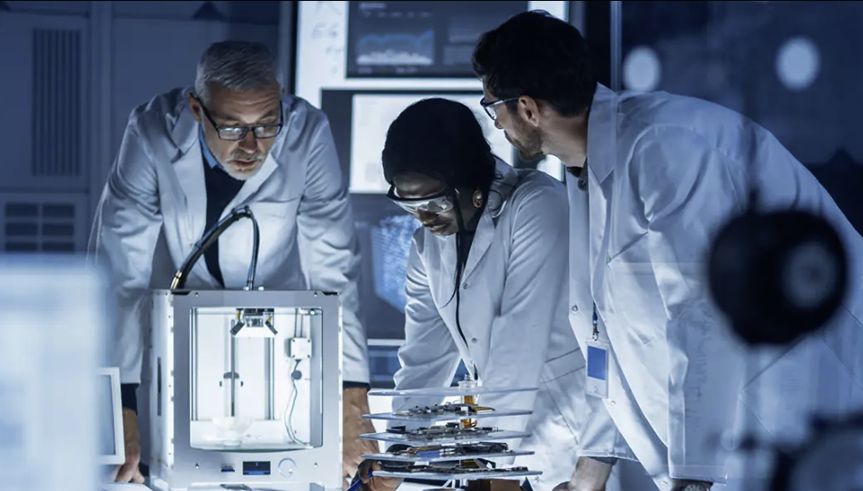 researchers gathered around a lab project